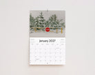 January 2027 page: snow-covered pine trees behind a stop sign and gate