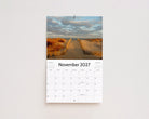 November 2027 page: a sandy path through the dunes leading to the beach